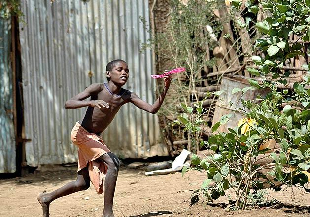 Playing frisbee with one of the kids.