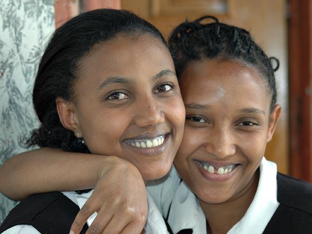 Sanite and Zanu - Two friends from National Hotel.  Notice the blue tatooing on the gums.