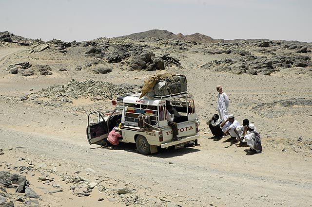 Fixing a flat tire in the middle of nowhere.