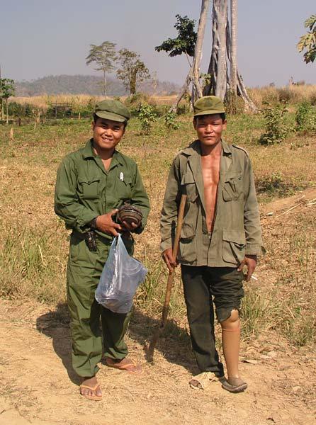On the left is Akira with a bag full of disarmed mines to take back to his museum.  On the right is a farmer/deminer who has been blown up by 6 mines.  His friends joke he is 