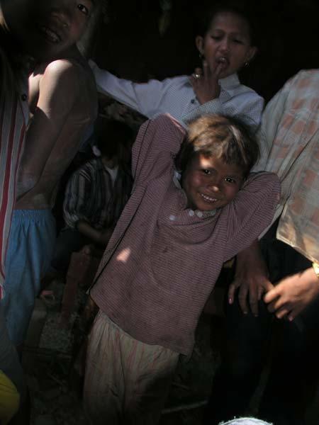 These kids may have never seen white people before.  But they certainly never had seen a digital camera.
