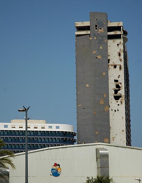 The holiday inn opened just before the civil war.  It became a favorite spot for snipers, the damage is of course from people firing shells of various caliber at the snipers..