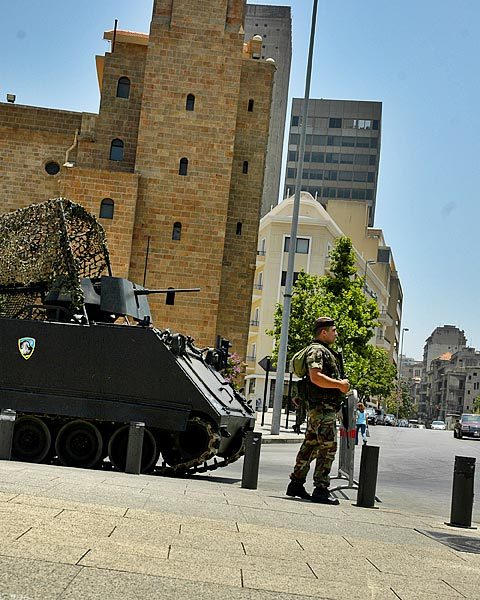 A armored personnel carrier watching over a major intersection downtown.