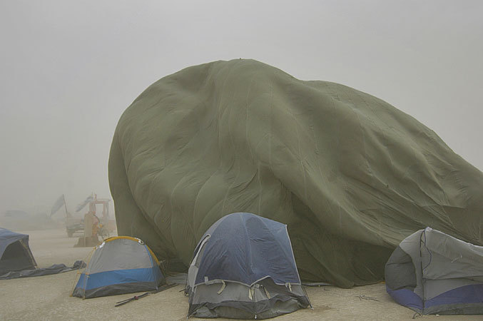 With the huge winds, any tents not held down with 2 foot rebar stakes have a real danger of blowing away.