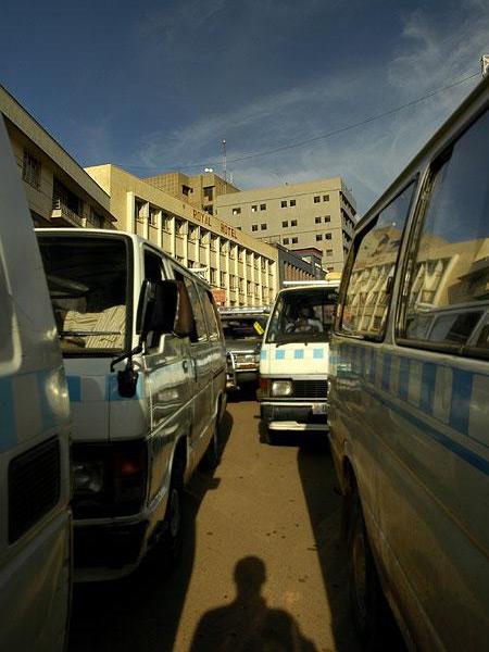 Kampala Traffic - I almost got killed crossing the street.  But as long as I was trapped between cars, I decided to snap a photo.