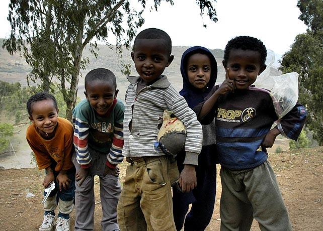 Kids in Gonder - notice the toys: a toy pistol, a superhero cape, and a hand-stitched soccer ball.