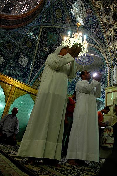 Men praying in the Sayyida Ruqayya Mosque.