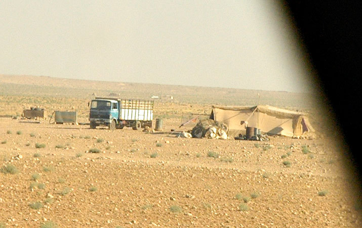 An encampment out in the middle of the desert.